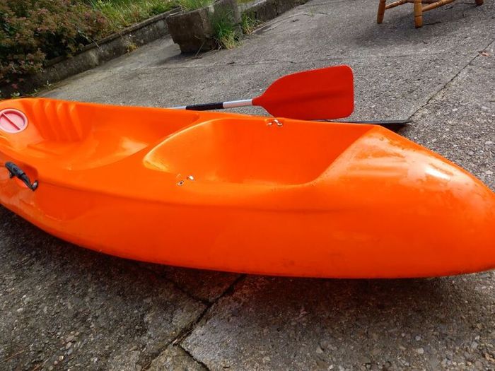 Kayak plus 2 paddles and 2 bouyancy aides