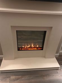 Electric fire and natural stone fireplace
