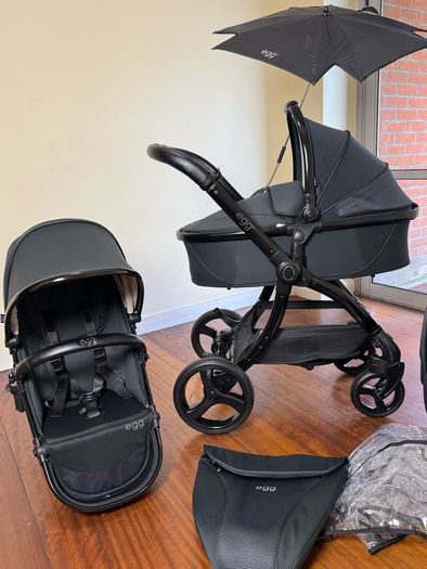 As New Egg2 travel system with Cybex car seat and isofix base swivel