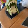 Dinosaur eating car Image 2