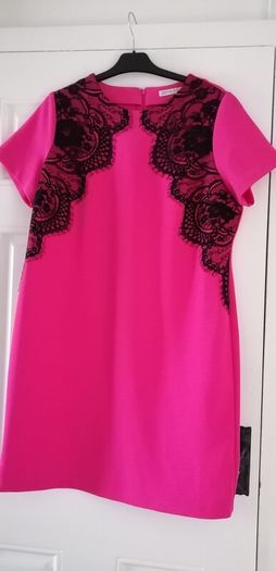 Dress size 18 deep pink with black lace detailing zip opening at back