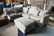 Large grey corner sofa with footstooll