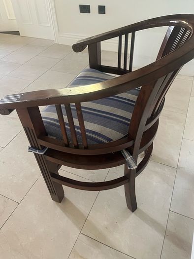 Traditional dark wooden chair with blue/grey cushion for office or study