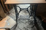 Singer base with teak top