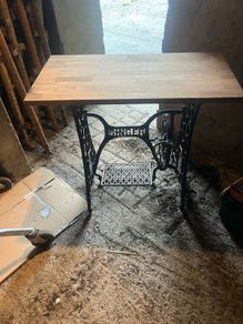 Singer base with teak top