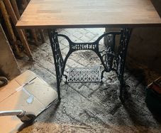 Singer base with teak top