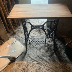 Singer base with teak top