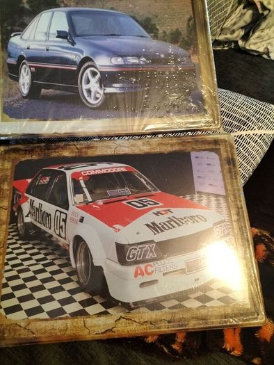 2 big vintage car signs