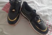 ladies new  black and gold soft leather trainers