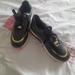 ladies black and gold soft leather trainers