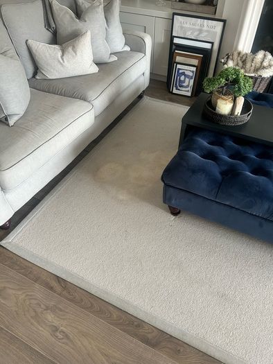 Cream rug with grey border