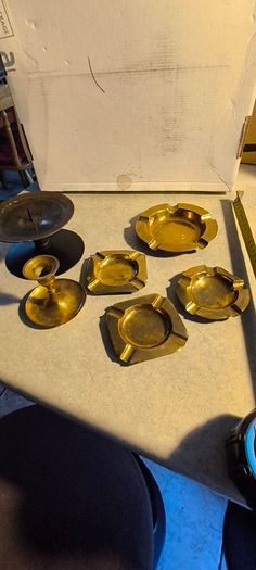 6 different itmes- 1- candle holder 12.00 euro. 2- candle holder round one 10.00 euro. 3- round ashtray12 cm. Dia. 12.00 euro. 4- small  round ashtray9.5 cm. Dia. 9.00 euro. 5-  2 small square ashtray 8 cm. Dia. 9.00 euro each.