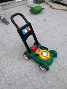 Kids push lawn mower