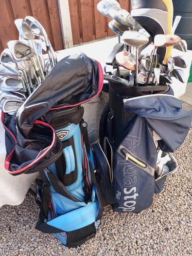 A selection of golf clubs and bags. All right handed clubs.