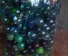 Antique collection of old marbles in large clip sealed jar at a  its full to the top attack findvery old house in france Beautiful