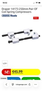 Coil spring compressors