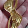Vintage gold tone bow brooch. Image 3