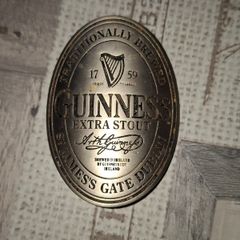 Vintage Metal Advertisement Plaque featuring the classic Guinness Extra Stout bottle label design from St. James's Gate, Dublin Iconic Guinness Harp Logo Postage Available or Collection