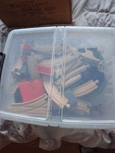 wooden train track set with wooden trains and accessories.