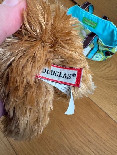 Dog stuffed animal in bag