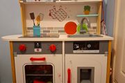 Wooden toy kitchen with lots of accessories