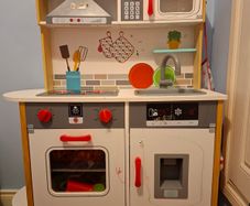 Wooden toy kitchen with lots of accessories
