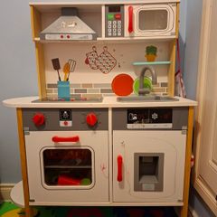 Wooden toy kitchen with lots of accessories