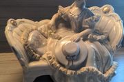 VINTAGE Porcelain Victorian Lady on Sofa Woman Statue Figurine sitting holding hat wearing a beautiful dress