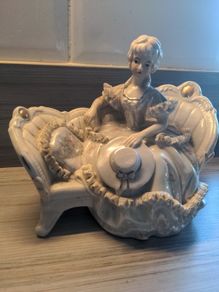 VINTAGE Porcelain Victorian Lady on Sofa Woman Statue Figurine sitting holding hat wearing a beautiful dress