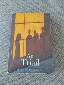 An Triail by Mairead Ni Ghrada in good used condition with some pencil writing and underlining on some pages see photos FREE STANDARD POSTAGE INCLUDED