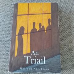 An Triail by Mairead Ni Ghrada in good used condition with some pencil writing and underlining on some pages see photos FREE STANDARD POSTAGE INCLUDED