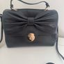 RED V Valentino genuine black leather crossbody bag with large bow and pink interior lining Image 6