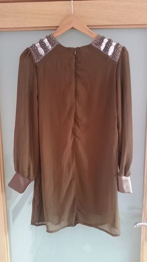 Brand New. Chiffon top with sequined shoulders