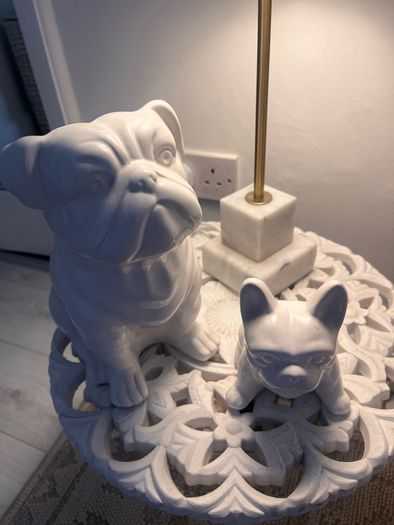 Two ceramic dog ornaments
