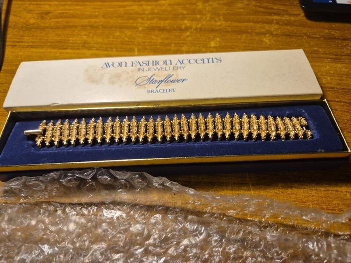 Rare Find. 1960s Avon Starflower gold plated bracelet in original box.