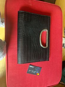 black clutch bag with silver strap. Croc effect