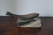 Vintage fish sculpture on marble
