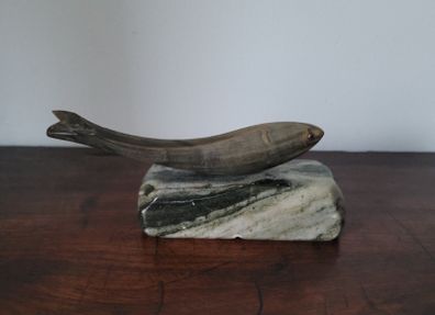 Vintage fish sculpture on marble