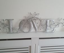 Metal "LOVE" wall art