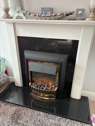 Fireplace with electric inset.