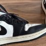 Nike Air Jordan 1 Mid trainers in the classic black, white and red colourway Image 9