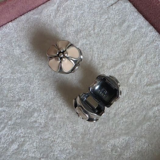 Pandora cherry blossom clips charm, featuring smooth cream enamel petals and a sterling silver beaded center very good condition