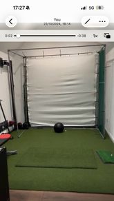 Golf - Hitting cage with impact screen and net around with it ..
