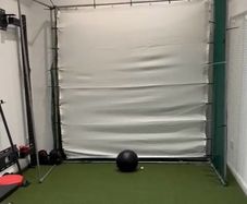 Golf - Hitting cage with impact screen and net around with it ..