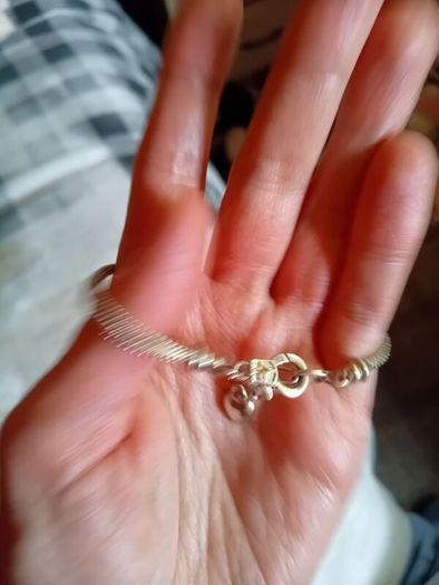 Silver toned bracelet with a heart shaped charm