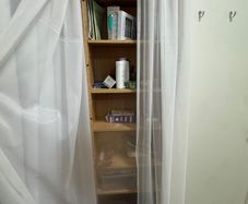 Tall wooden shelving unit