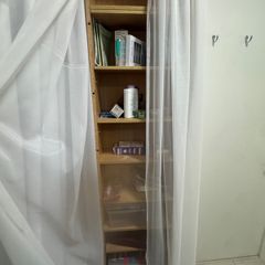 Tall wooden shelving unit