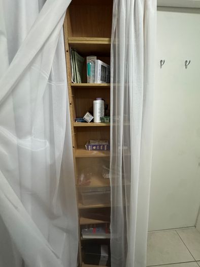 Tall wooden shelving unit