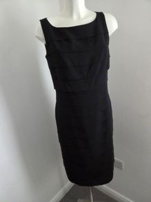Never Worn. Size 10 Fully lined tiered black dress from Debut.