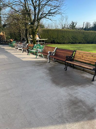 Raised beds bird feeders and cast iron benches